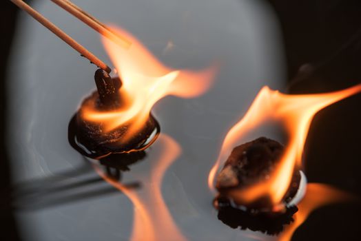 Incense sticks lightened with oil candles, Chengdu, China