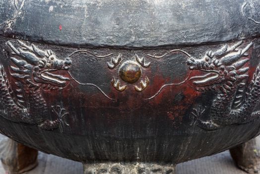 Two dragons sculpted on an iron incense burner, Wenshu Monastery, Chengdu, China