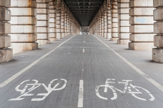 Bike path under Bercy bridge in Paris, France