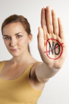 Female Protestor With "No" Wrtitten On Palm