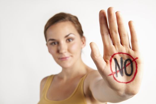 Female Protestor With "No" Written On Palm