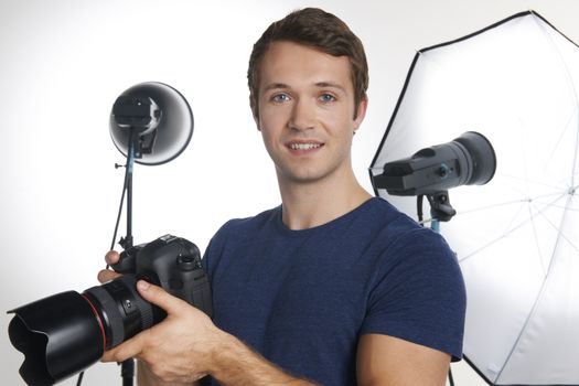 Male Professional Photographer Working In Studio