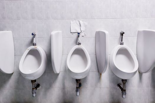 Male urinals in public toilets