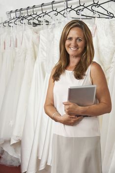 Portrait Of Female Bridal Store Owner With Digital Tablet