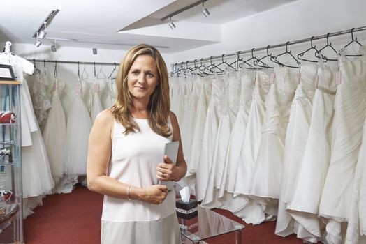 Portrait Of Female Bridal Store Owner With Digital Tablet