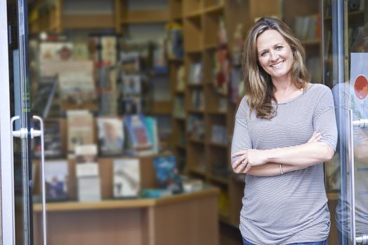 Portrait Of Female Bookshop Owner Outside Store