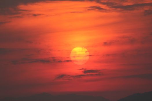 Evening sunset surrounded by clouds