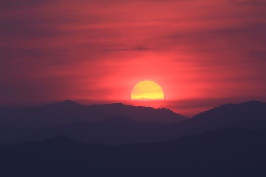 Evening sunset surrounded by clouds