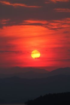 Evening sunset surrounded by clouds