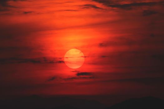 Evening sunset surrounded by clouds