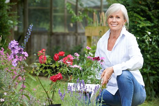 Portrait Of Mature Woman Gardening