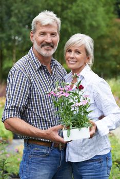 Portrait Of Mature Couple Shopping At Garden Center