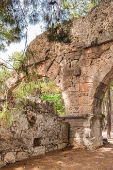 Panorama view of ancient cemetery. Ruins of Phaselis city in North harbour. Famous architectural landmark. Turkey.