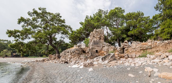 Panorama view of ancient cemetery. Ruins of Phaselis city in North harbour. Famous architectural landmark. Turkey.