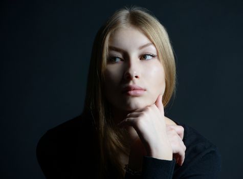 Spiritual and mental studio portrait of the Russian beautiful teenage girl with light long hair