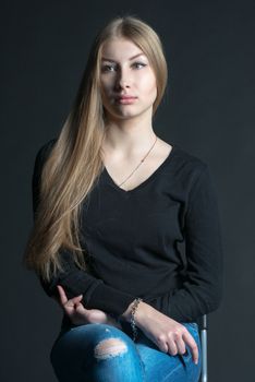 Spiritual and mental studio portrait of the Russian beautiful teenage girl with light long hair