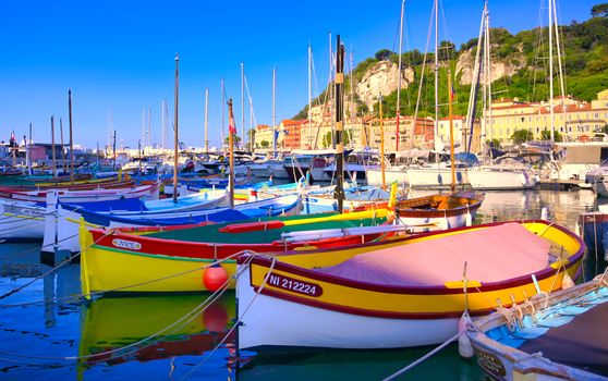 Nice, France - June 08, 2019 - Fishing boats docked in the port along the French Riviera on the Mediterranean Sea at Nice, France.