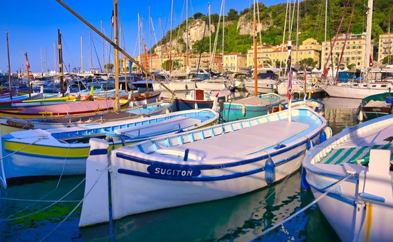 Nice, France - June 08, 2019 - Fishing boats docked in the port along the French Riviera on the Mediterranean Sea at Nice, France.