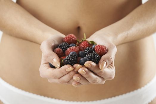 Close Up Of Woman In Underwear Holding Fresh Summer Berries