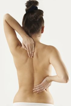 Studio Shot Of Woman With Painful Back