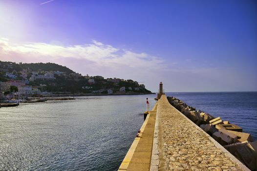 The lighthouse at the Port of Nice on the Mediterranean Sea at Nice, France along the French Riviera.