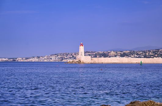 The lighthouse at the Port of Nice on the Mediterranean Sea at Nice, France along the French Riviera.