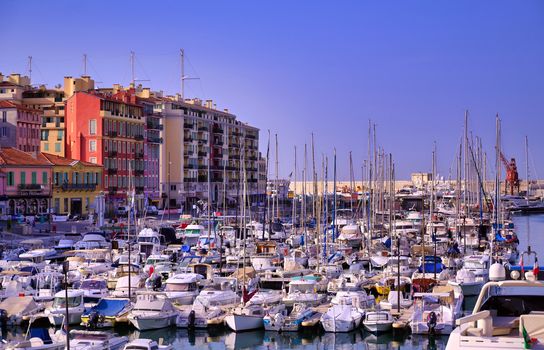 Nice, France - June 11, 2019 - Fishing boats docked in the port along the French Riviera on the Mediterranean Sea at Nice, France.