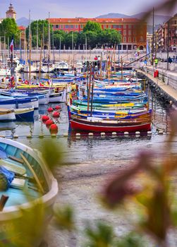 Nice, France - June 11, 2019 - Fishing boats docked in the port along the French Riviera on the Mediterranean Sea at Nice, France.