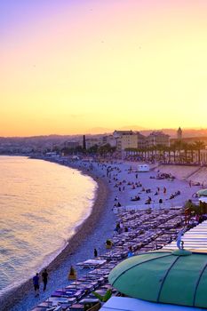 Nice, France - June 8, 2019 - The Promenade des Anglais on the Mediterranean Sea at Nice, France along the French Riviera at sunset.