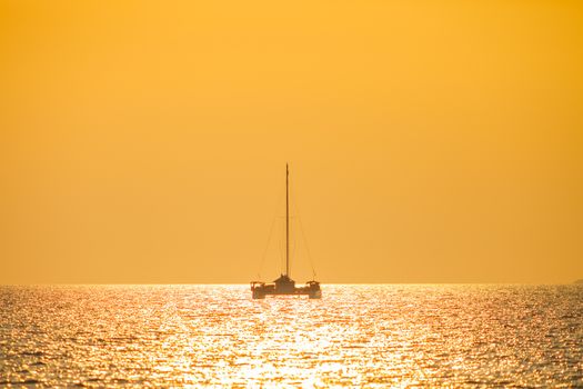 Yacht is parking in tropicana of sea at sunset is reflecting on water located at south of Thailand