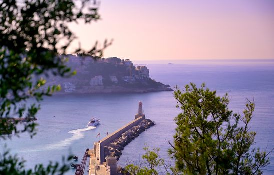 The lighthouse at the Port of Nice on the Mediterranean Sea at Nice, France along the French Riviera.