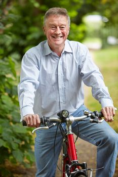 Senior Man Enjoying Cycle Ride