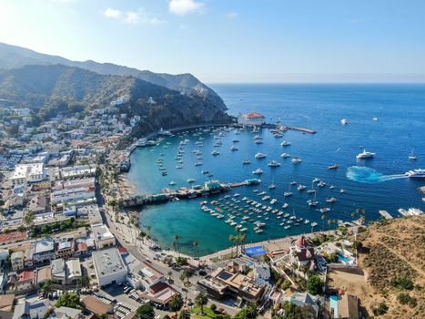 Aerial view of Avalon downtown and bay with boats in Santa Catalina Island, famous tourist attraction in Southern California, USA