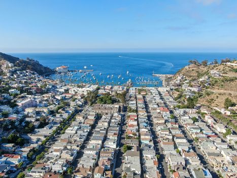 Aerial view of Avalon downtown and bay with boats in Santa Catalina Island, famous tourist attraction in Southern California, USA