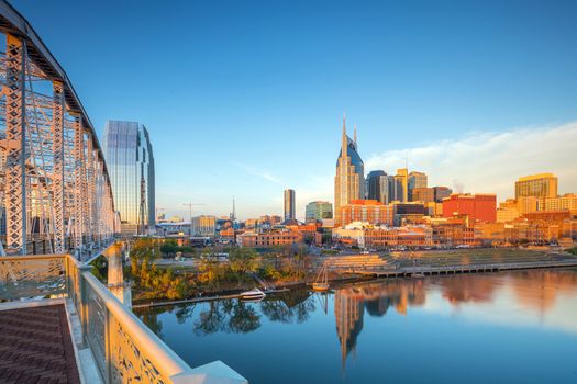 Nashville, Tennessee downtown skyline with Cumberland River in USA at sunset