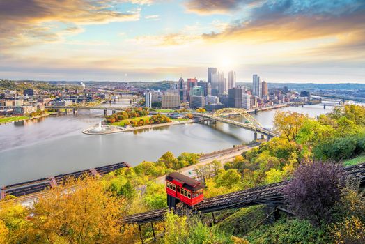 Downtown skyline and vintage incline in Pittsburgh, Pennsylvania, USA at sunset