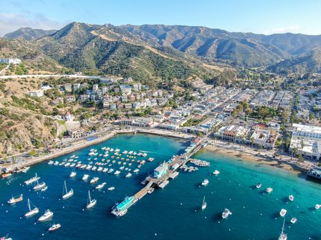 Aerial view of Avalon downtown and bay with boats in Santa Catalina Island, famous tourist attraction in Southern California, USA