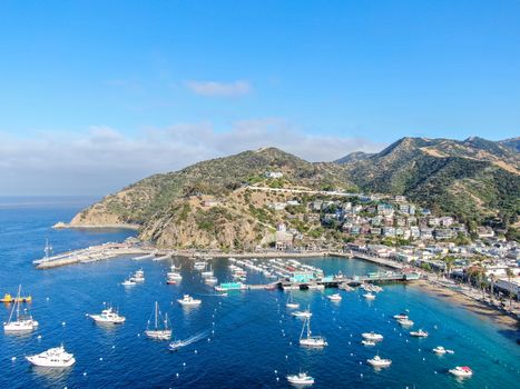 Aerial view of Avalon downtown and bay with boats in Santa Catalina Island, famous tourist attraction in Southern California, USA