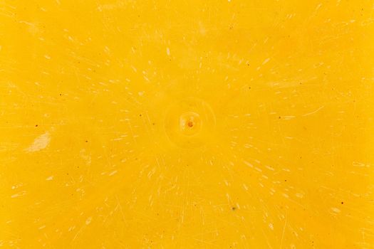 close-up flat texture and background of yellow bakelite or carbolite plastic material.