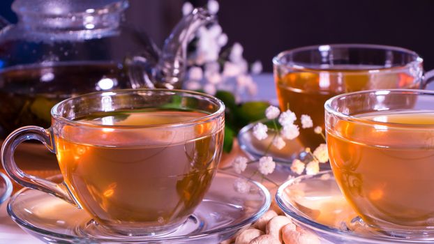 Flower tea with fruit slices. A Cup of green tea and a teapot. Tea ceremony, traditional drink. Afternoon tea, homelike. Flat lay. Oriental, cozy, preparation, heat, tradition, japanese, leafy, herbal