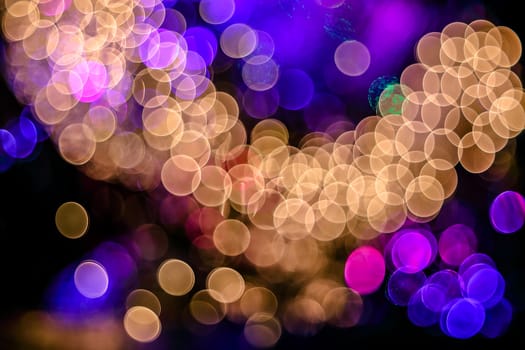 Christmas background. Festive abstract background with bokeh defocused lights. Beautiful shiny photo with bokeh. Garland.