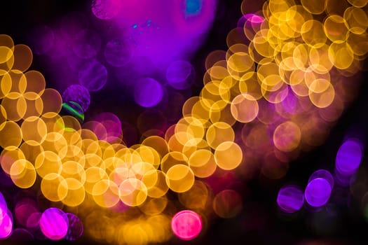 Background of abstract booble bokeh lights. Natural defocused photo. Christmas light blurred, abstract background. Garland. Copy space.