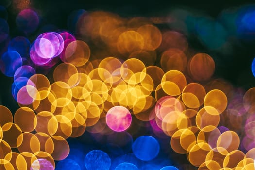 Festive Christmas elegant abstract background with booble bokeh lights. Background with defocused lights. Garland. Copy space.