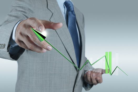 businessman hand drawing a pie chart and 3d graph