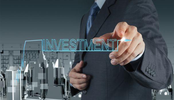 businessman hand pointing to investment concept