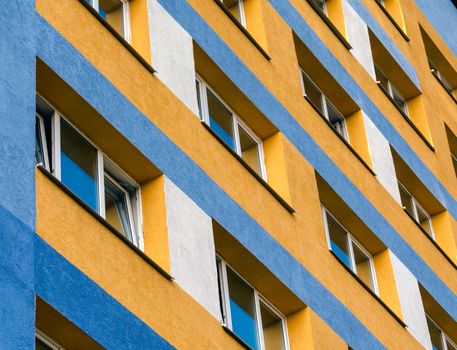 modern house with yellow and blue walls and empty windows without people quarantine isolation