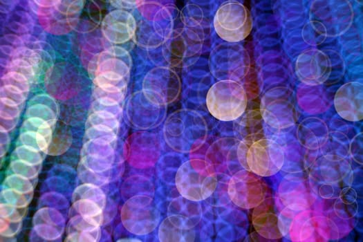 Abstract, defocused, blurred Christmas light background. Multicolor bokeh circle background (illumination garland decoration).