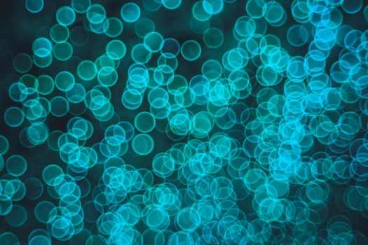 Classic bokeh “soap bubbles” Aqua Menthe. Festive elegant abstract background with booble bokeh lights. Background with defocused lights. Copy space.