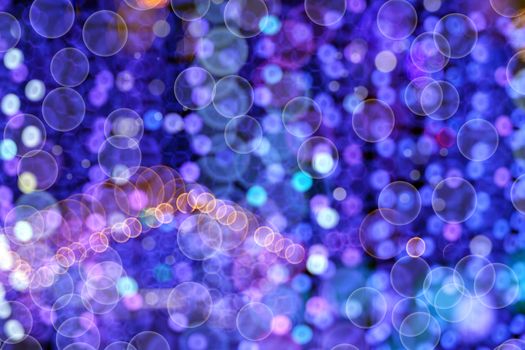 Christmas lights and ornaments. Multicolor bokeh circle background (illumination garland decoration). 