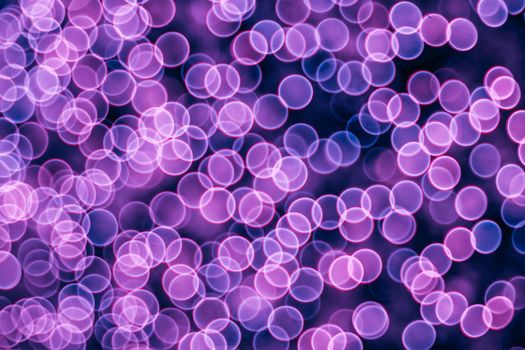 Classic bokeh “soap bubbles” violet. Festive Christmas elegant abstract background with booble bokeh lights. Background with defocused lights. Copy space.
